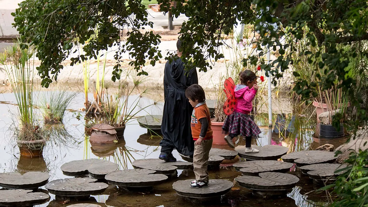 This pond had a series of stepping stones decorated as lilypads. They seemed to be made of rubber or plastic and moved a bit when stepping on them.
