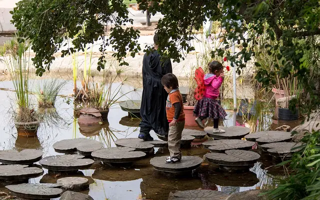 This pond had a series of stepping stones decorated as lilypads. They seemed to be made of rubber or plastic and moved a bit when stepping on them.