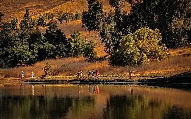 Here I'm in Milpitas at a lake, when I looked up and saw a line of people walking. I liked the look, and just had to have a photo.