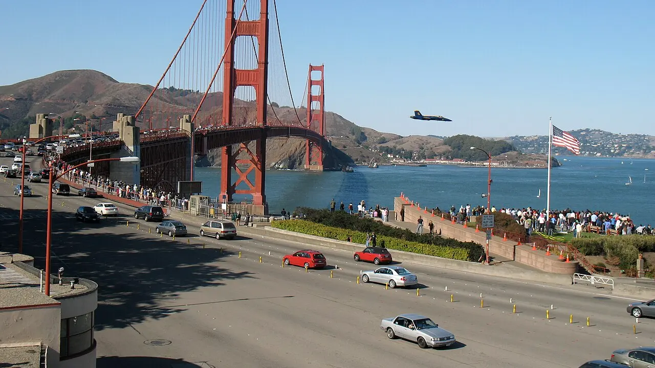 US Navy Blue Angel aircraft making a low pass over the crowd at the Golden Gate Bridge during the 2008 San Francisco Fleet Week.