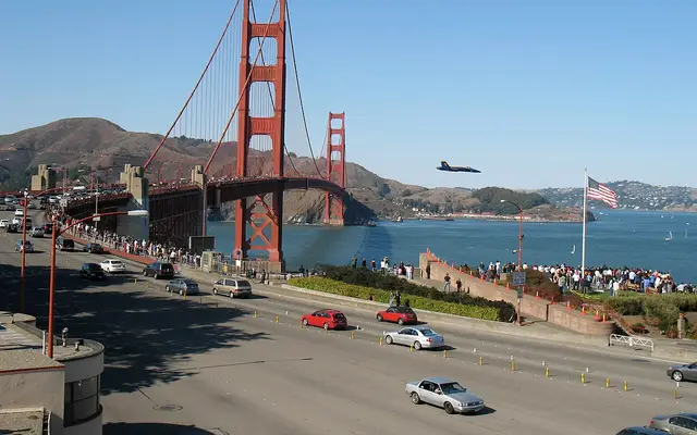 US Navy Blue Angel aircraft making a low pass over the crowd at the Golden Gate Bridge during the 2008 San Francisco Fleet Week.