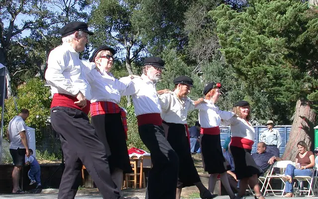 People performing a Greek line dance at the Greek festival in Belmont, California.